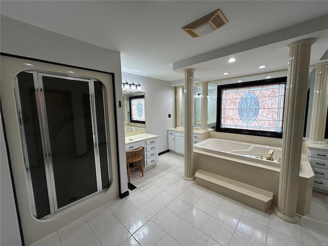 full bath featuring a healthy amount of sunlight, visible vents, decorative columns, and a bath