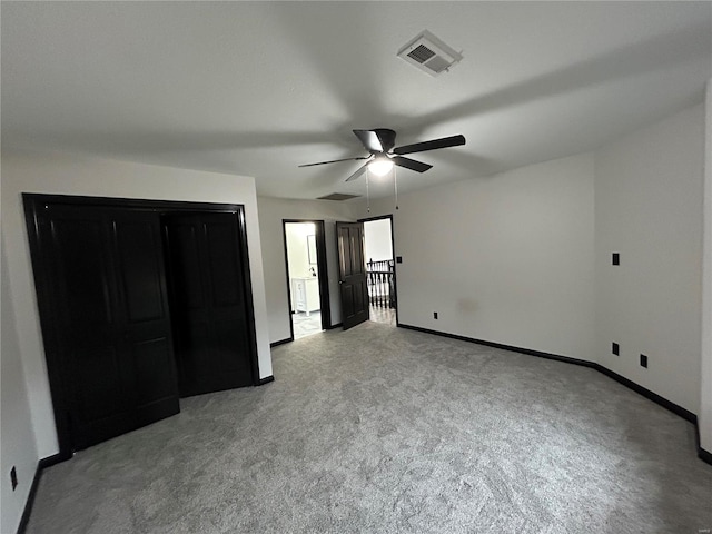 unfurnished bedroom with visible vents, ceiling fan, light carpet, and baseboards