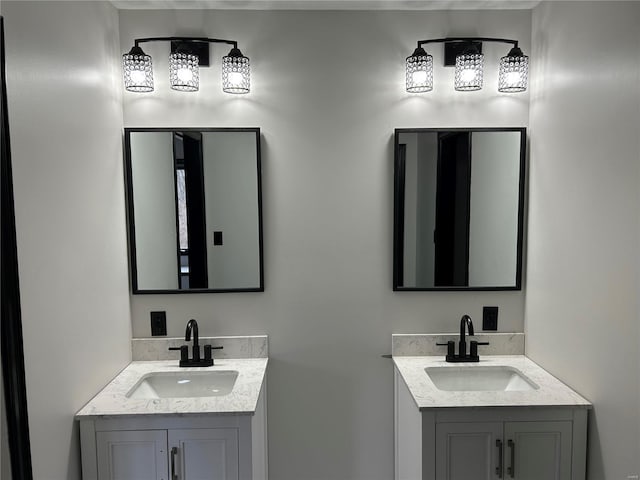 bathroom with two vanities and a sink