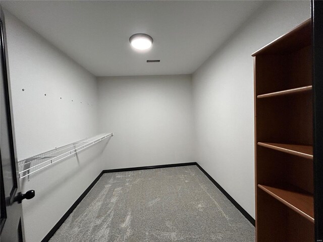 spacious closet with carpet and visible vents