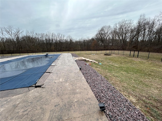 view of swimming pool with a fenced in pool, a patio area, fence, and a lawn