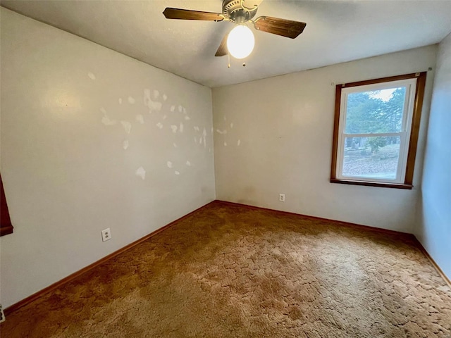 unfurnished room with carpet and ceiling fan