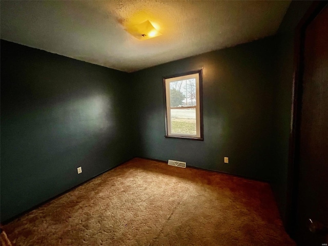 unfurnished room with carpet