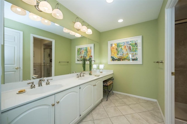 bathroom featuring a shower with door, toilet, tile patterned flooring, and vanity