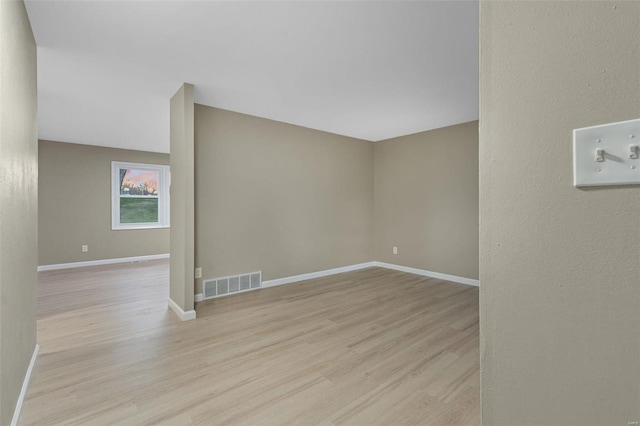 unfurnished room featuring light hardwood / wood-style flooring