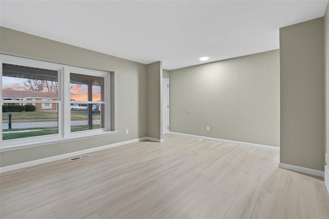 empty room featuring light hardwood / wood-style floors