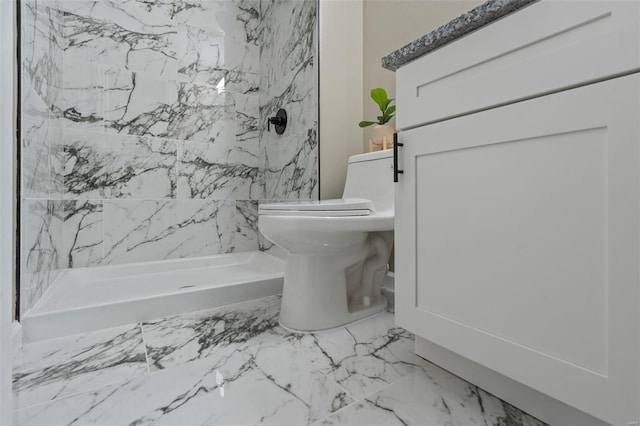 bathroom featuring a shower and toilet