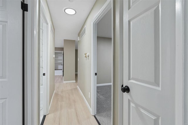 hallway featuring light wood-type flooring