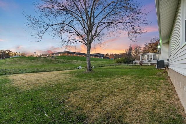 yard at dusk with central AC