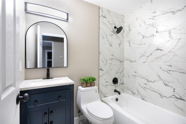 full bathroom featuring toilet, tiled shower / bath combo, and vanity