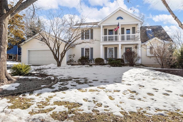 view of front of house featuring a garage and a balcony