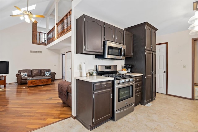 kitchen with light hardwood / wood-style flooring, dark brown cabinets, stainless steel appliances, and ceiling fan