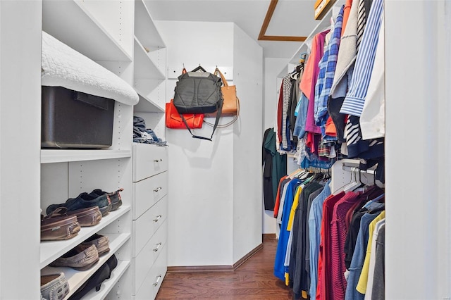 walk in closet featuring dark wood-type flooring