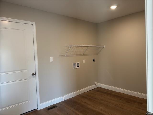 washroom with dark hardwood / wood-style floors, hookup for a washing machine, and electric dryer hookup