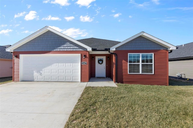 view of front facade featuring a garage and a front lawn