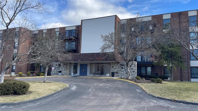 view of building exterior with driveway