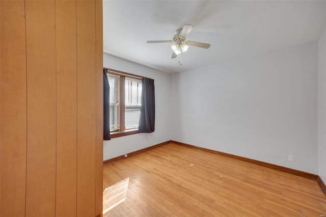 spare room featuring ceiling fan and light hardwood / wood-style flooring