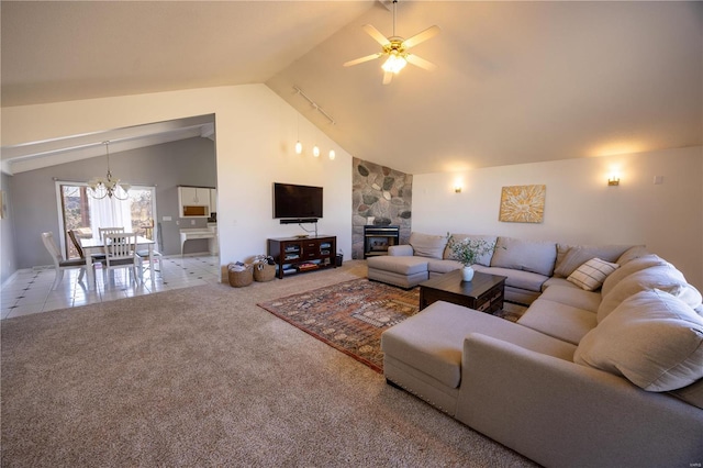 living room with carpet, ceiling fan with notable chandelier, and high vaulted ceiling