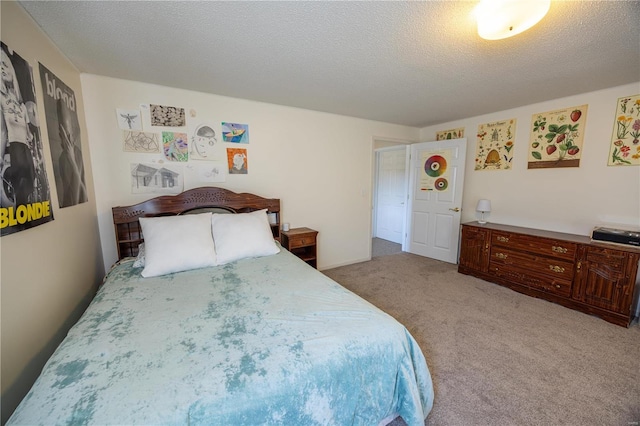 carpeted bedroom with a textured ceiling