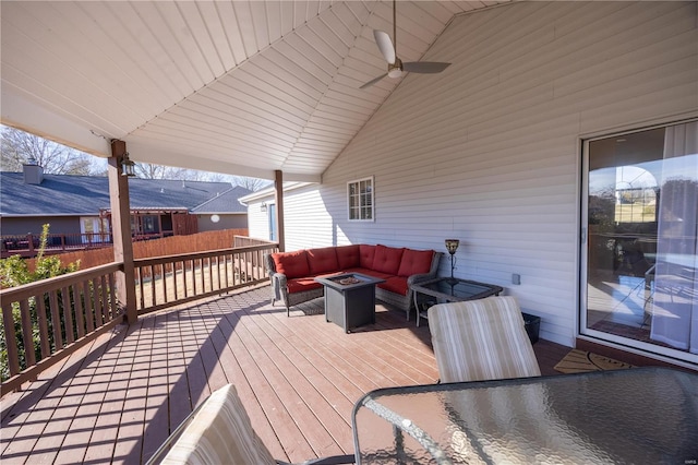 wooden terrace featuring an outdoor living space with a fire pit and ceiling fan