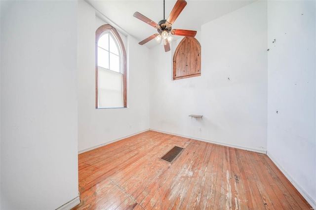 spare room with ceiling fan and light hardwood / wood-style floors