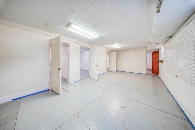 basement with a textured ceiling