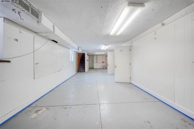 basement with a textured ceiling