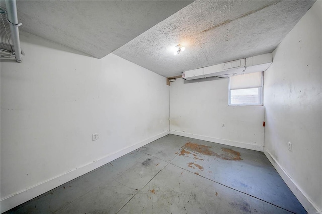 basement featuring a textured ceiling