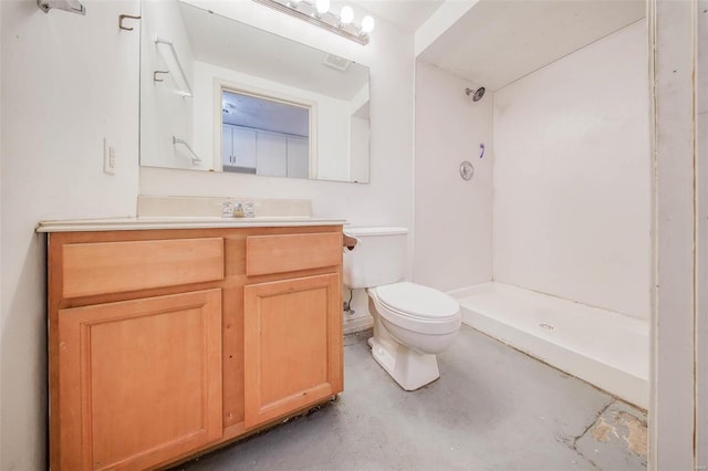 bathroom featuring vanity, concrete flooring, toilet, and a shower