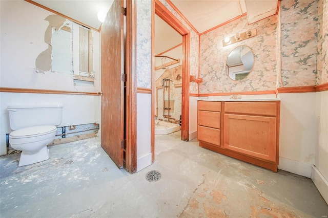 bathroom with toilet, vanity, concrete flooring, and a shower