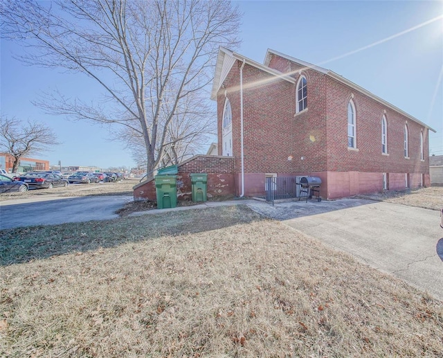 view of side of property with a yard