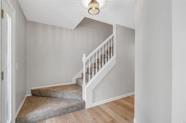 stairs with wood-type flooring