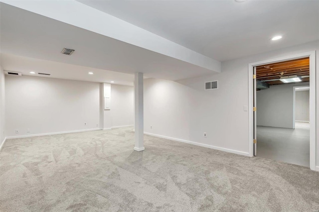 basement featuring light colored carpet