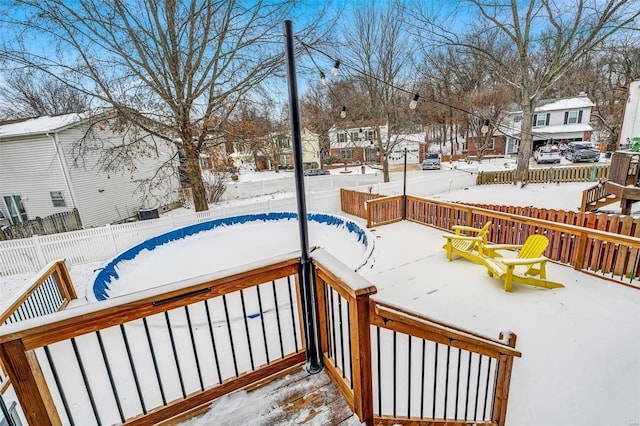 view of snow covered deck