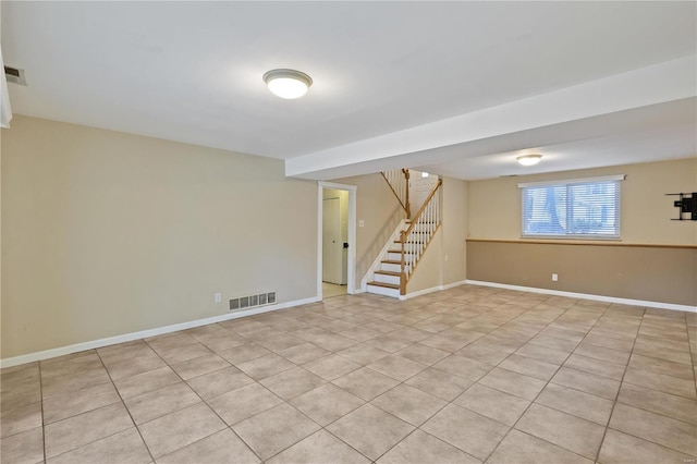 basement featuring light tile patterned floors