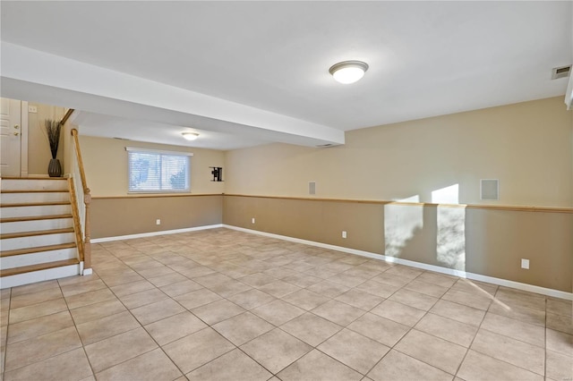 basement with light tile patterned flooring