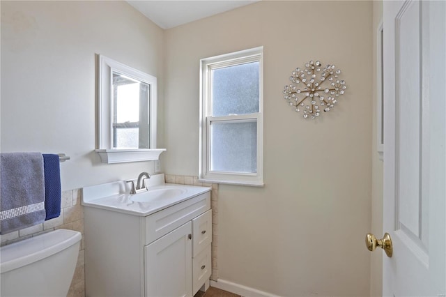 bathroom featuring vanity and toilet