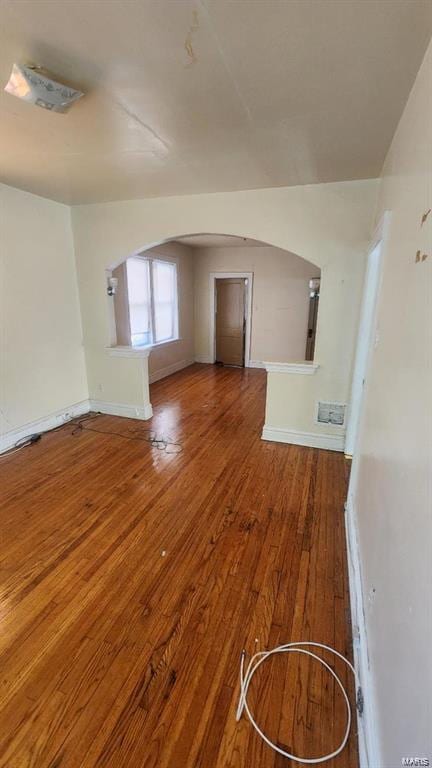 unfurnished living room featuring hardwood / wood-style flooring