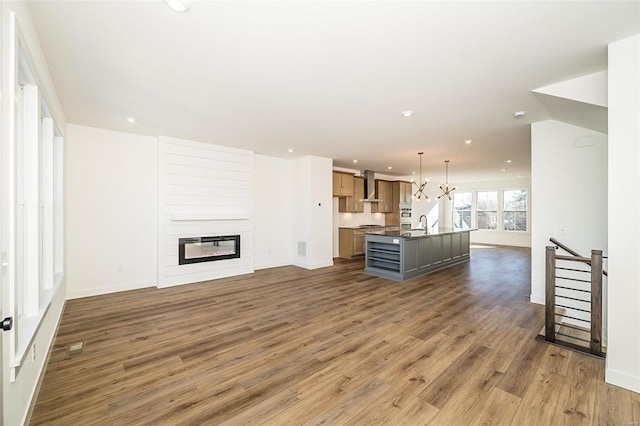 unfurnished living room featuring dark hardwood / wood-style flooring