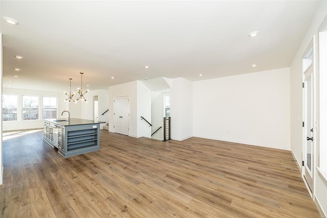 interior space featuring sink, dark wood-type flooring, and a chandelier