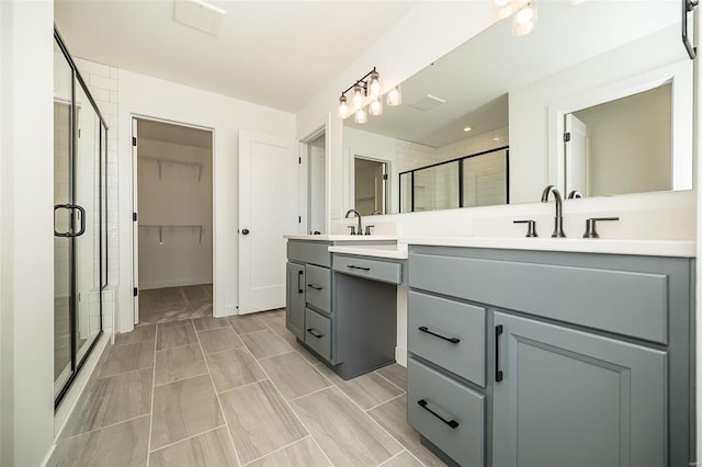 bathroom with vanity and an enclosed shower