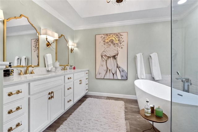 bathroom featuring vanity, a tub, and crown molding