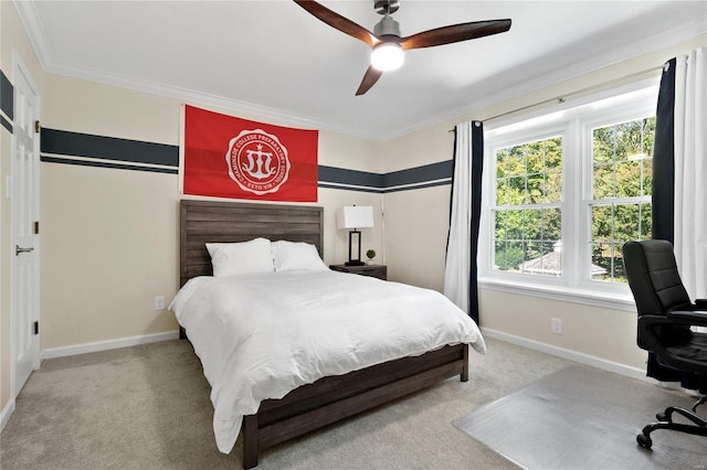 bedroom with ceiling fan, light colored carpet, and ornamental molding