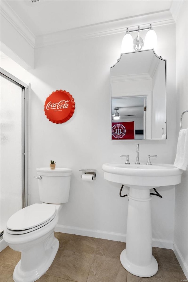 bathroom featuring toilet, tile patterned flooring, and ornamental molding