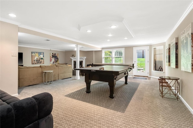 playroom with light colored carpet, a fireplace, and ornamental molding