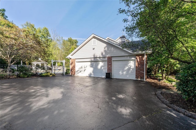 view of side of home with a garage