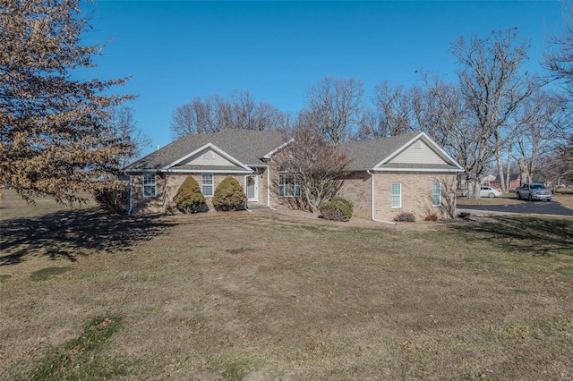 ranch-style home featuring a front yard