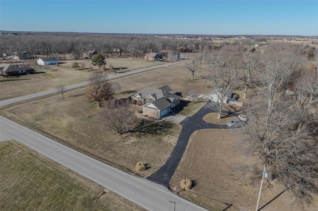 birds eye view of property with a rural view