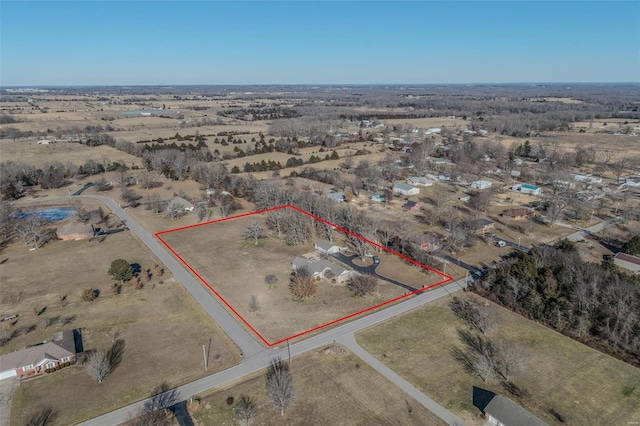 birds eye view of property featuring a rural view