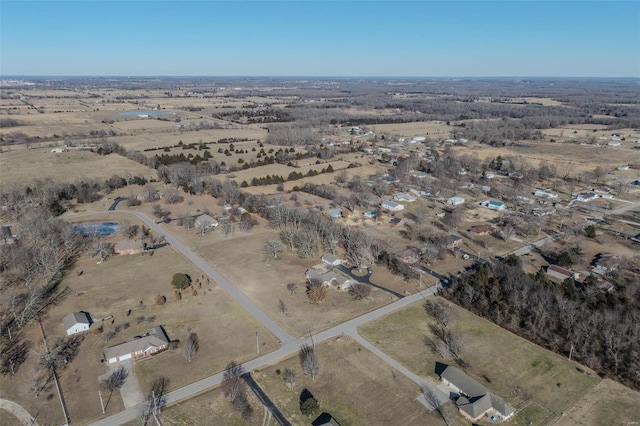 birds eye view of property with a rural view